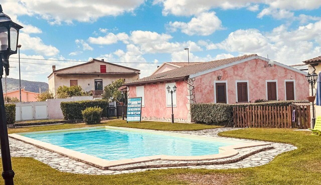 Beautiful apartment for 4 people with A/C, pool, TV and patio